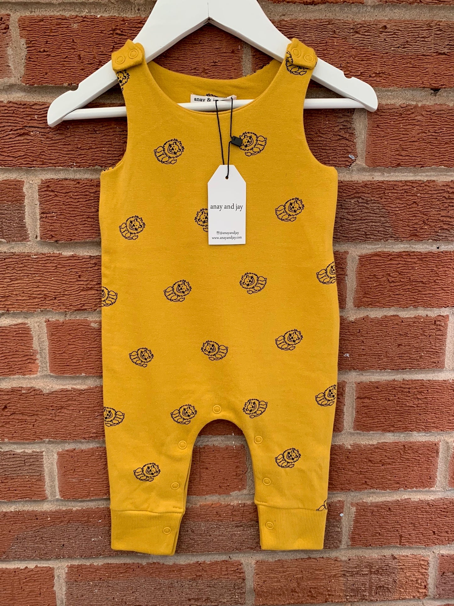 Unisex lion all over print baby romper