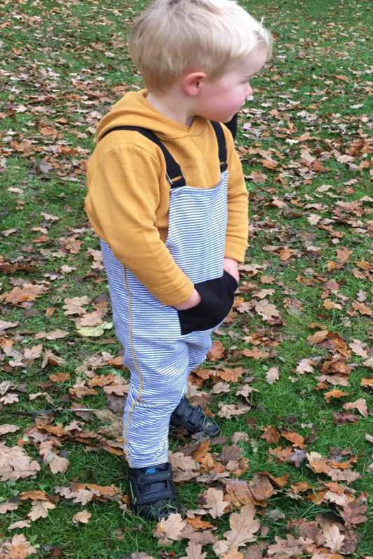 Unisex black and white stripy jersey kids dungaree