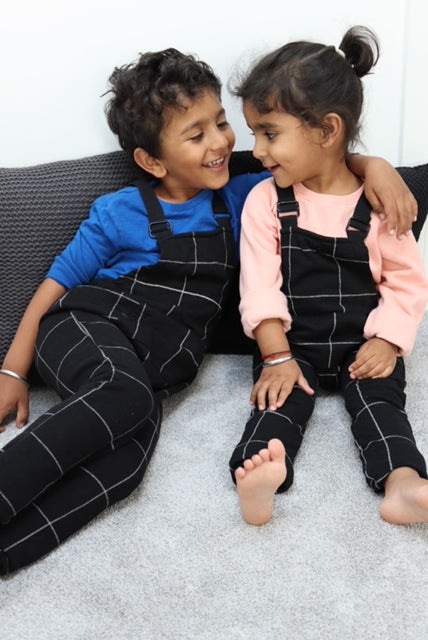 Black unisex check kids dungaree
