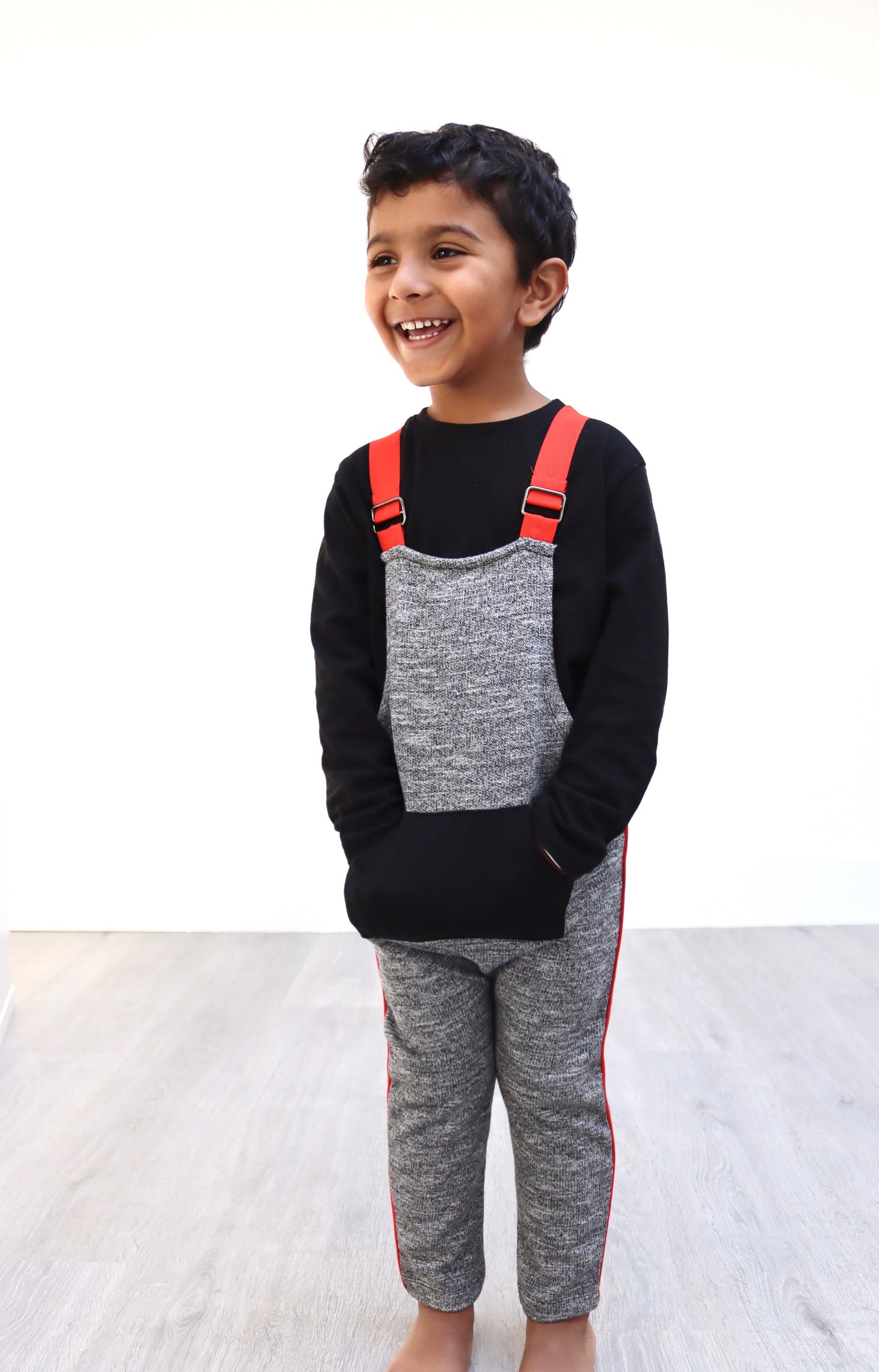 Unisex grey marl kids dungaree with orange piping
