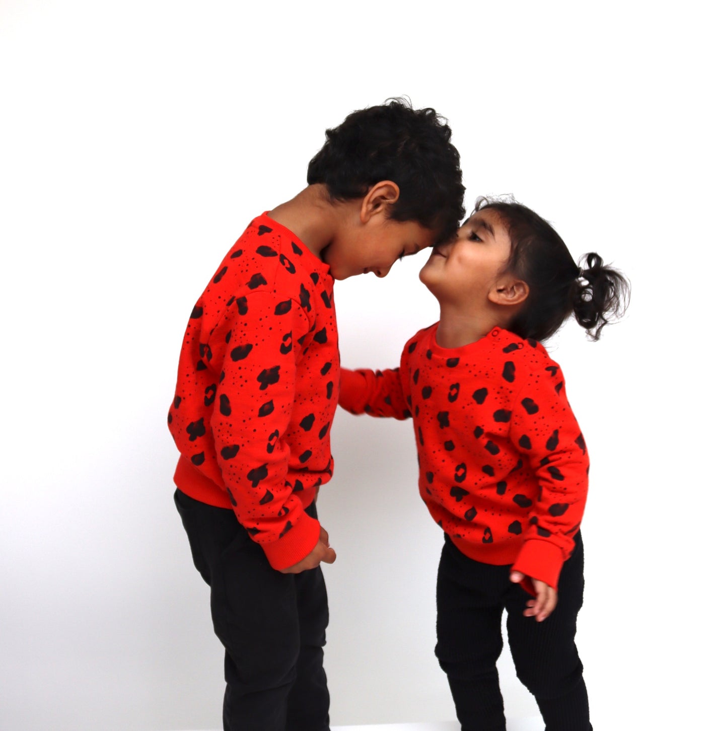 our story, kids are wearing beautiful animal print jumpers